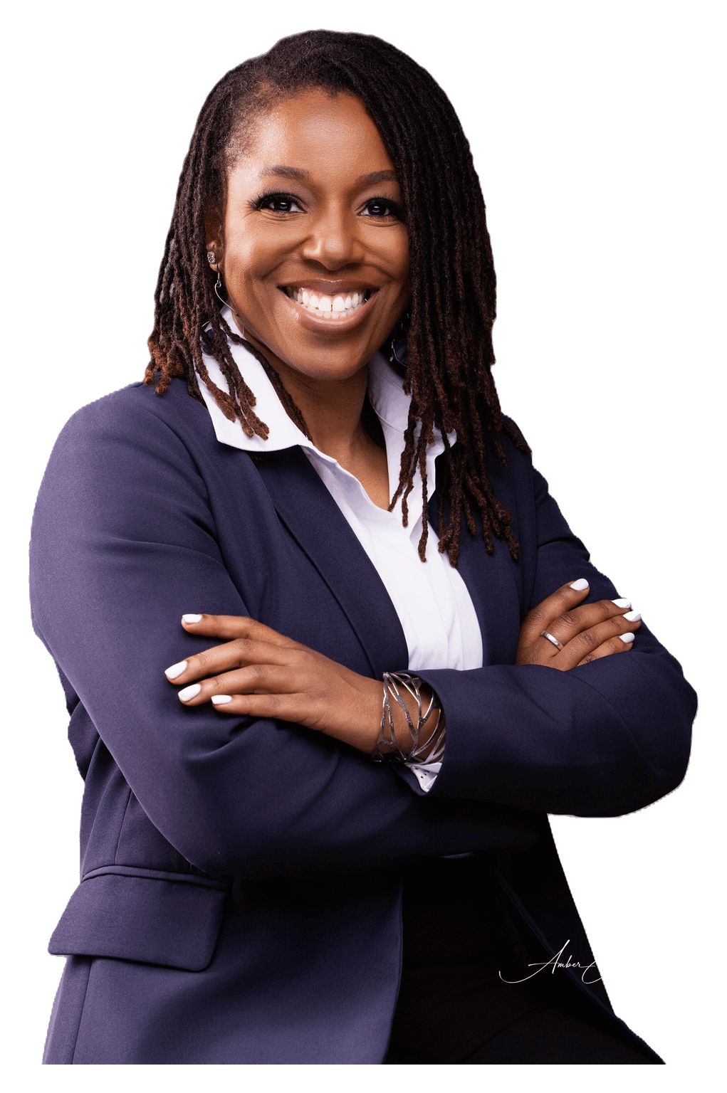Casilda, founder of LowKey Defense, wearing a navy blazer and smiling warmly