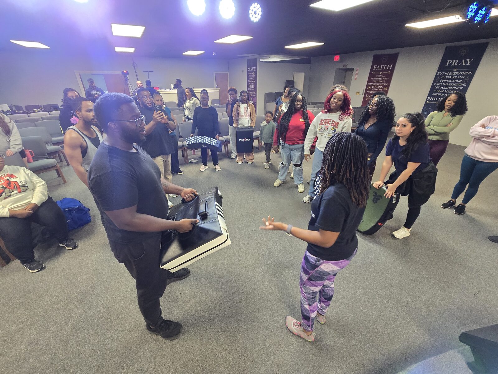 Casilda leading a group self-defense class